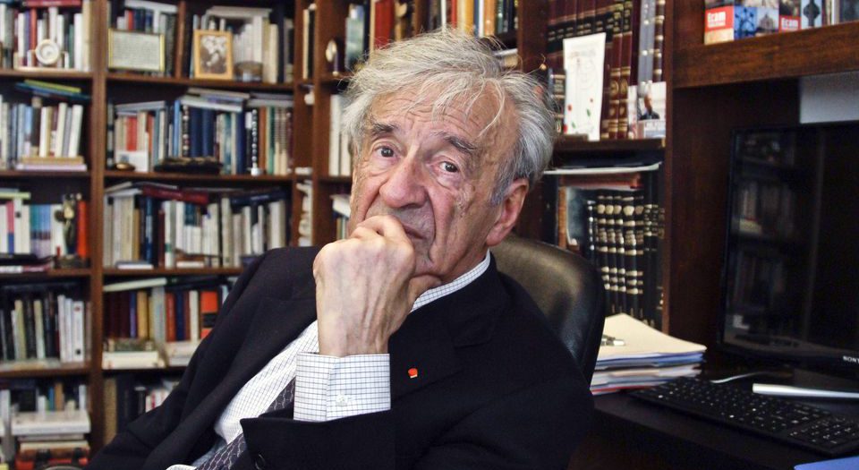 Author and Nobel Laureate Elie Wiesel surrounded by books.