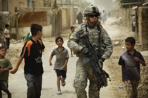 080804-A-8725H-341 

      Iraqi children gather around as U.S. Army Pfc. Shane Bordonado patrols the streets of Al Asiriyah, Iraq, on Aug. 4, 2008.  Bordonado is assigned to 2nd Squadron, 14th Cavalry Regiment, 25th Infantry Division.  DoD photo by Spc. Daniel Herrera, U.S. Army.  (Released)